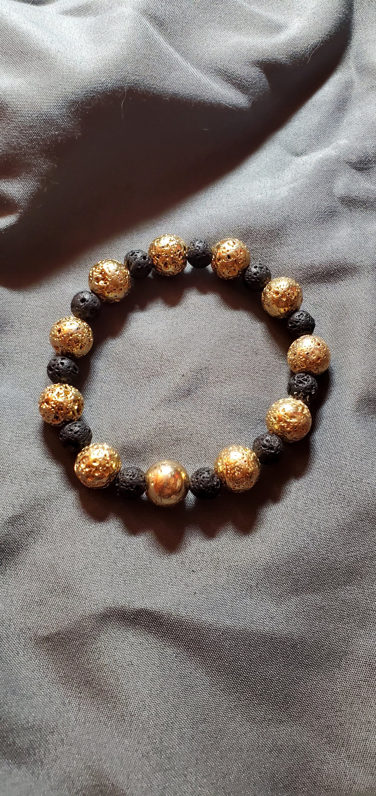 Gold Leafed Hematite And Hematite Stretch Bracelet