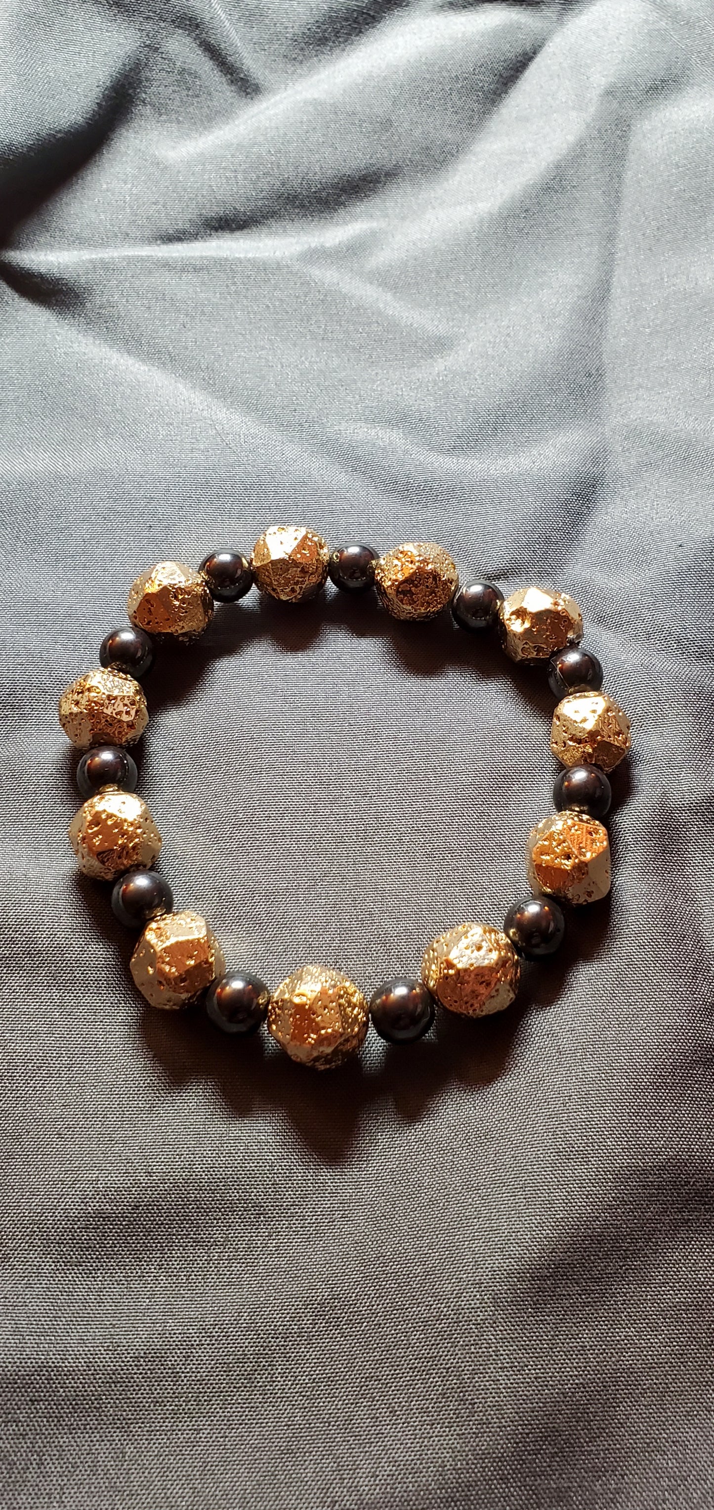 Gold Leafed Hematite And Hematite Stretch Bracelet